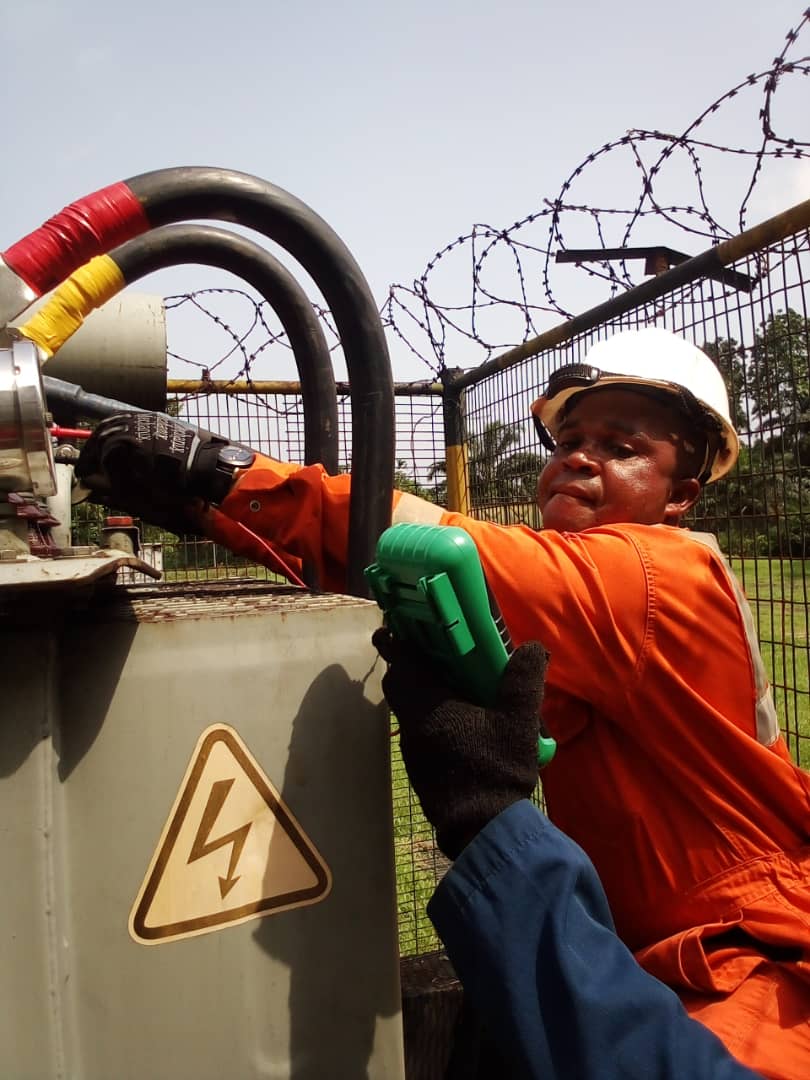 Alibanger technician servicing a transformer