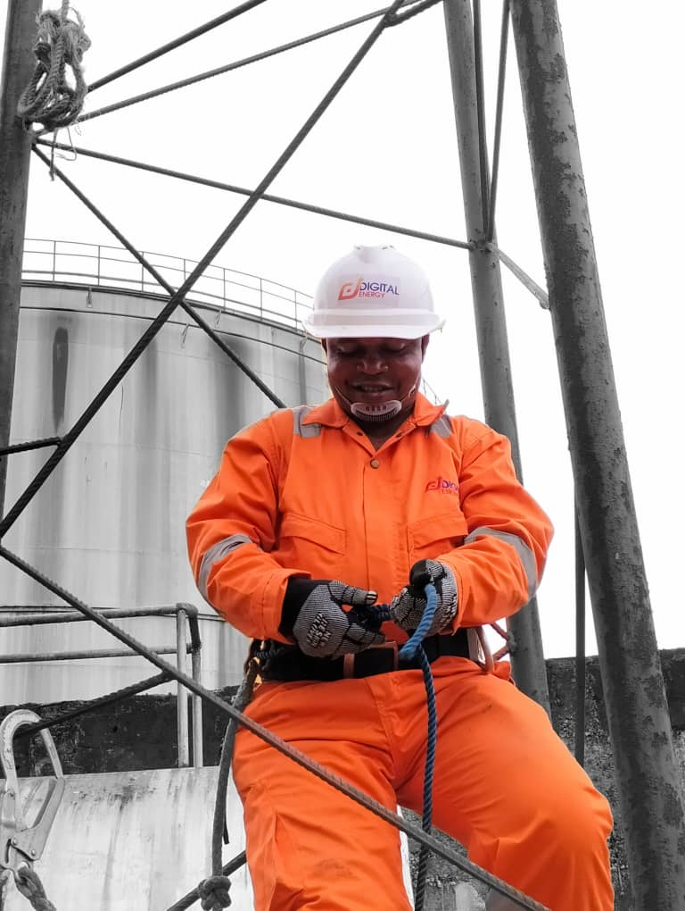 Engineer installing tower earthing system